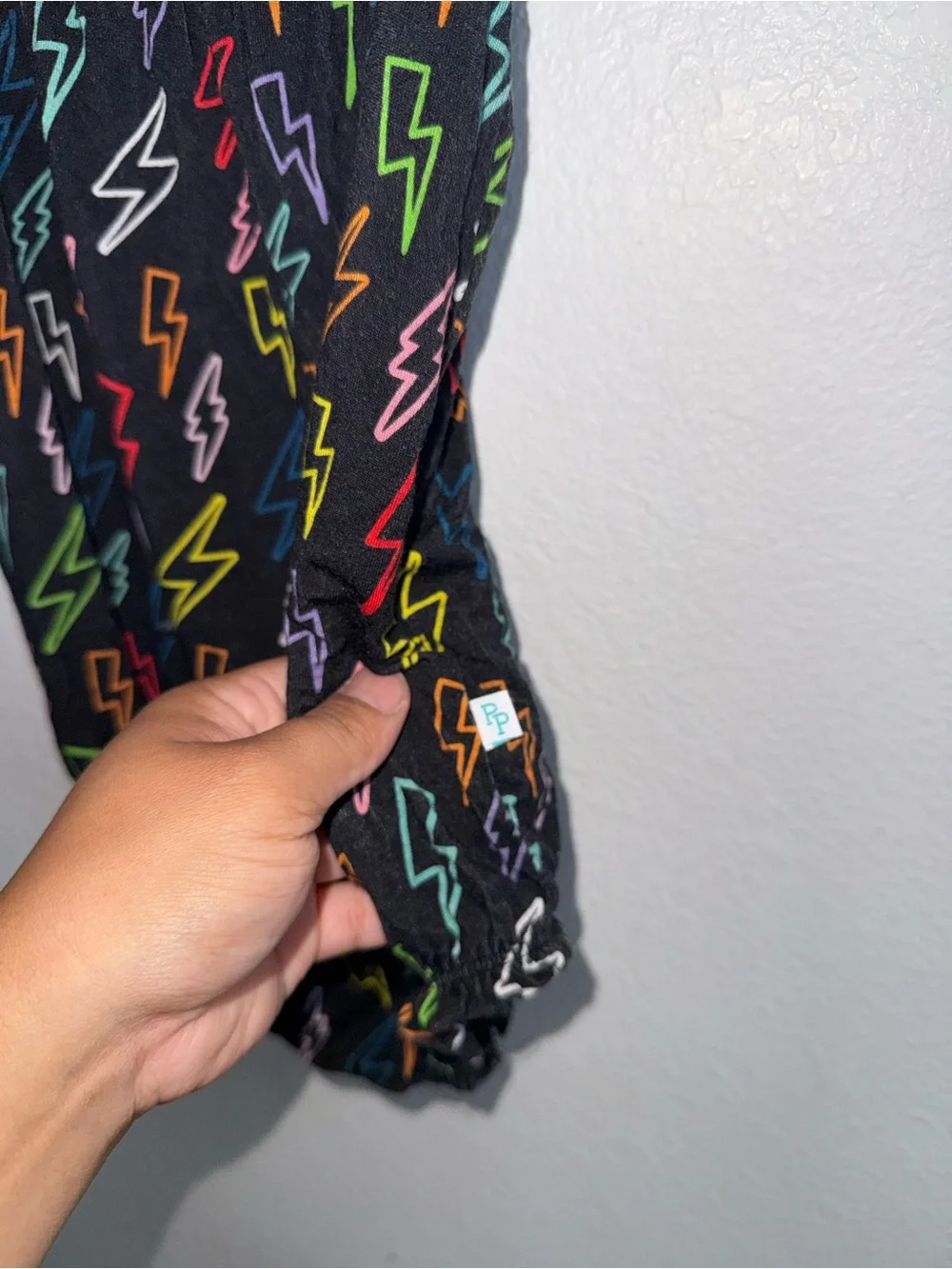 Posh Peanut Black Lightning Bolt Print One-Piece Bodysuit